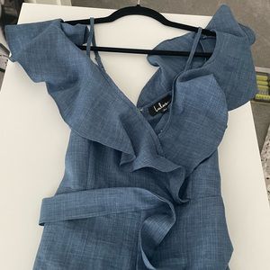 Lulu soft denim color wide leg jumpsuit. Never worn. Ruffle shoulder.